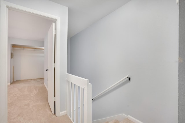 stairway with carpet floors and baseboards
