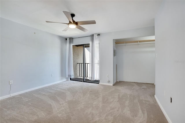 unfurnished bedroom with carpet floors, baseboards, ceiling fan, and a closet