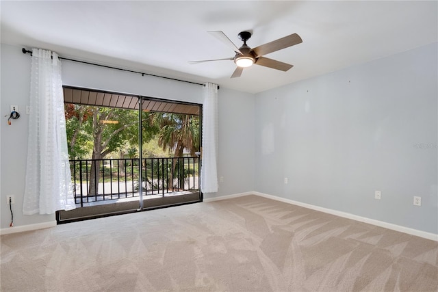 unfurnished room featuring baseboards, a ceiling fan, and carpet flooring