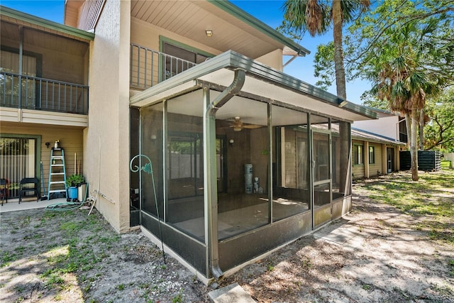 back of house with a sunroom