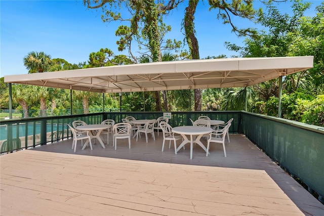view of patio featuring a deck and outdoor dining area