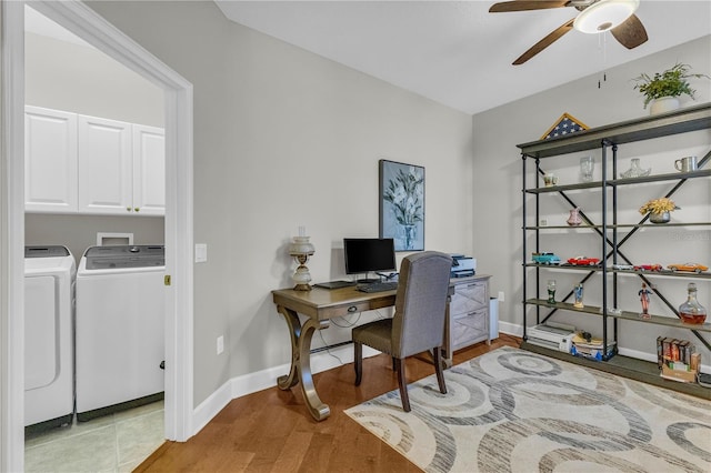 office area with a ceiling fan, separate washer and dryer, baseboards, and wood finished floors