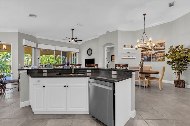 kitchen featuring visible vents, ornamental molding, a sink, and dishwasher
