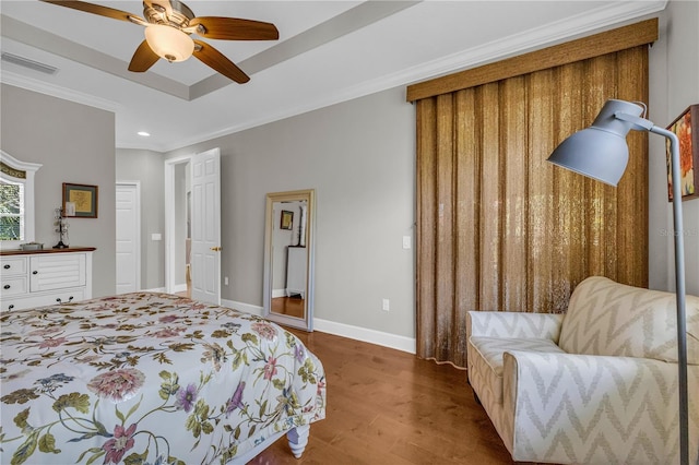 bedroom featuring visible vents, crown molding, wood finished floors, baseboards, and recessed lighting