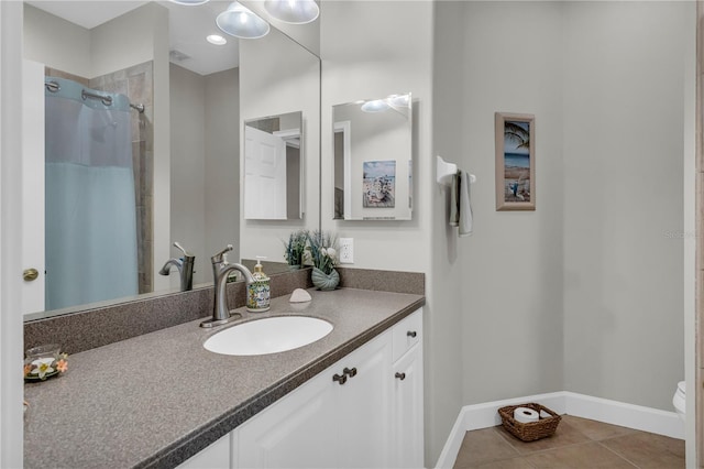 927 River Basin Ct Unit 201C, Bradenton, FL 34212 - full bath featuring baseboards, tile patterned floors, a shower with shower curtain, vanity, and toilet