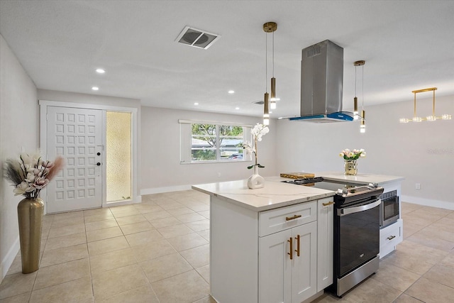 kitchen with visible vents, island range hood, built in microwave, stainless steel electric stove, and light stone counters