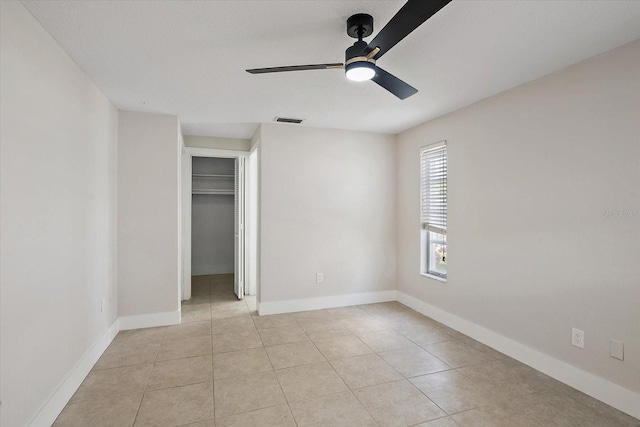 unfurnished bedroom with baseboards, visible vents, and light tile patterned floors