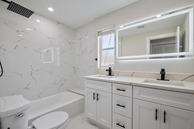 bathroom featuring double vanity, toilet, a sink, and marble finish floor