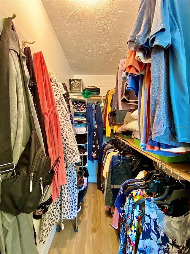 spacious closet with light wood-style floors