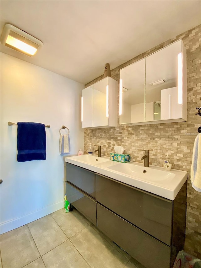 bathroom featuring a sink, tile patterned floors, decorative backsplash, and double vanity