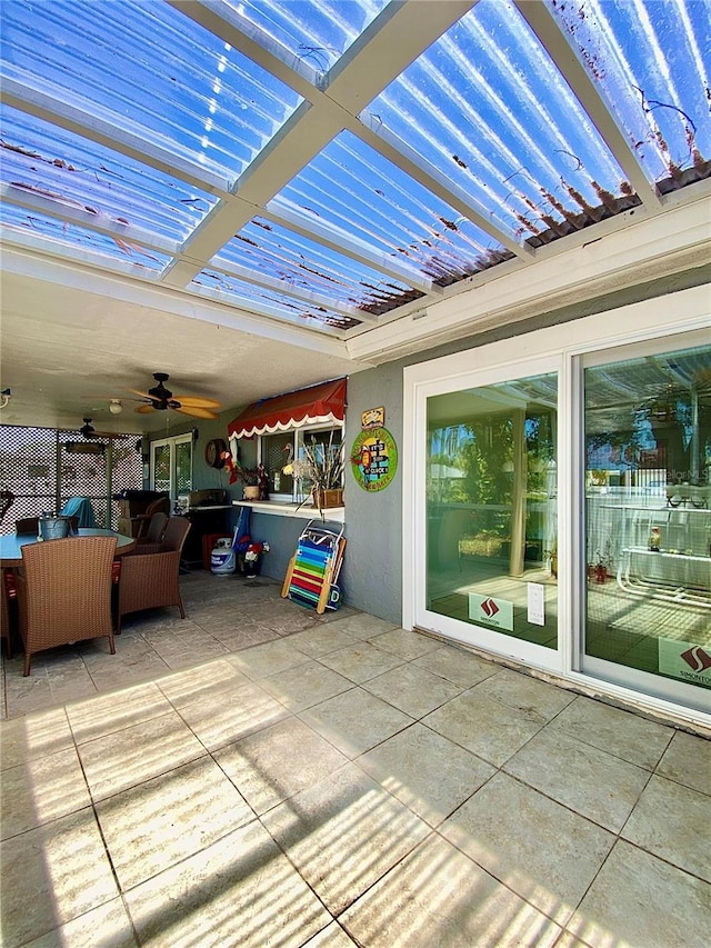 view of patio / terrace featuring a ceiling fan and outdoor dining space