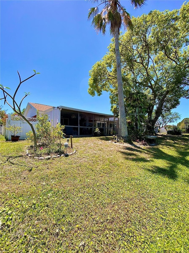 view of yard with a sunroom