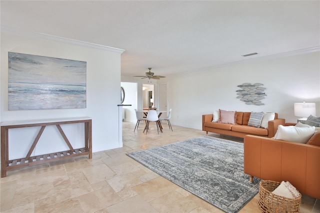 10108 Kingfisher Rd E, Bradenton, FL 34209 - living room with ornamental molding, stone tile floors, baseboards, and ceiling fan