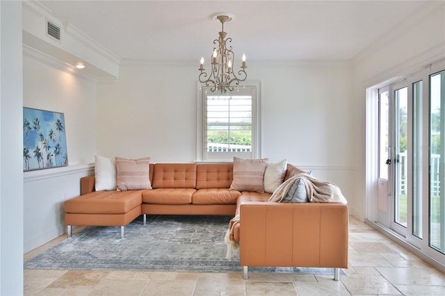 10108 Kingfisher Rd E, Bradenton, FL 34209 - living room with crown molding, a chandelier, baseboards, and light stone finish floors