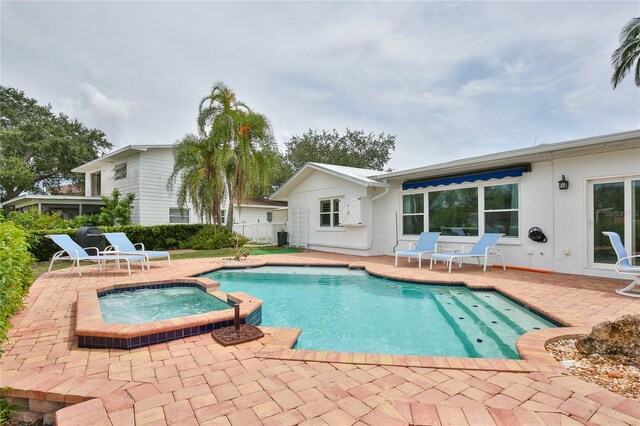 10108 Kingfisher Rd E, Bradenton, FL 34209 - view of pool featuring a patio area and a pool with connected hot tub