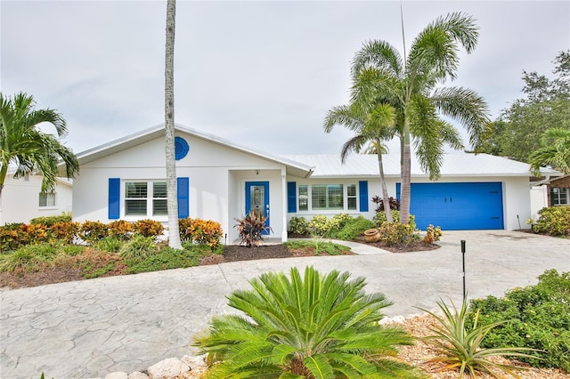 10108 Kingfisher Rd E, Bradenton, FL 34209 - ranch-style house with driveway, a garage, and stucco siding