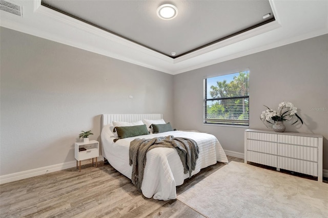 8123 Wawana Rd, North Port, FL 34287 - bedroom with visible vents, a raised ceiling, radiator, ornamental molding, and light wood-style flooring