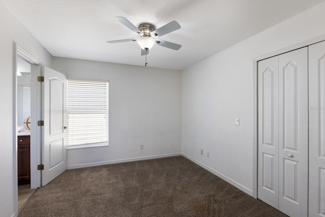 unfurnished bedroom featuring carpet floors, baseboards, a closet, and ceiling fan