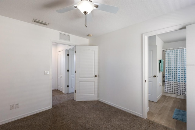 unfurnished bedroom featuring baseboards, a ceiling fan, and visible vents