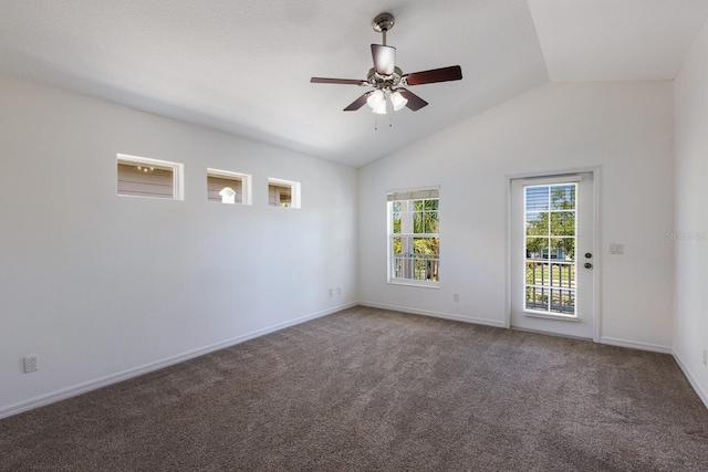 carpeted empty room featuring baseboards, a ceiling fan, and lofted ceiling