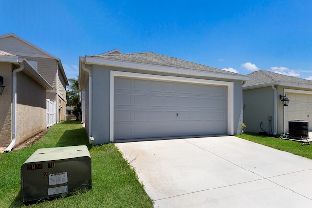 detached garage featuring central air condition unit