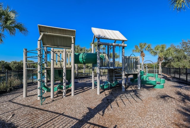community jungle gym featuring fence