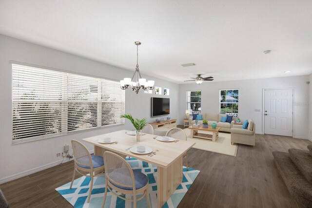 5526 River Sound Ter, Bradenton, FL 34208 - dining area featuring wood finished floors, baseboards, a chandelier, and a ceiling fan