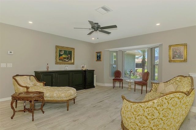 living area featuring visible vents, light wood-style floors, baseboards, ceiling fan, and recessed lighting