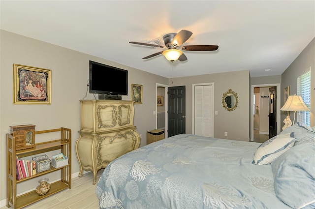 bedroom with baseboards, ceiling fan, and a closet