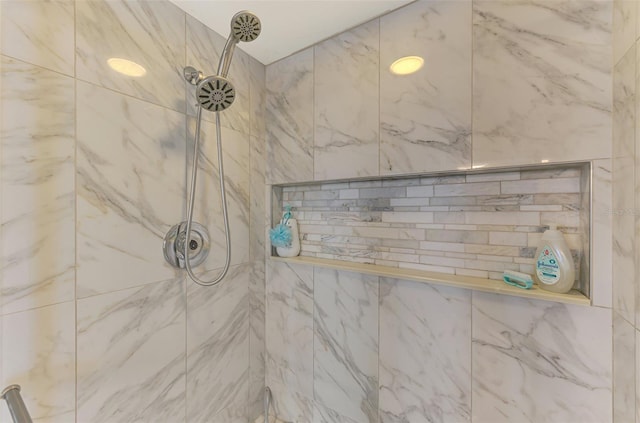 full bathroom with tiled shower