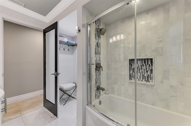 full bathroom with baseboards, visible vents, and bath / shower combo with glass door