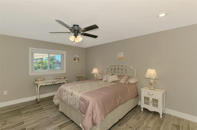 bedroom with baseboards, recessed lighting, light wood-style flooring, and ceiling fan