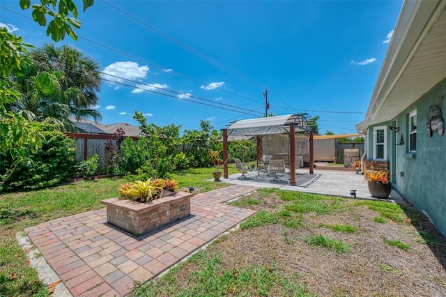 view of yard featuring a patio, a fenced backyard, and a pergola
