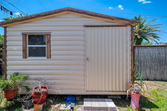 view of shed with fence