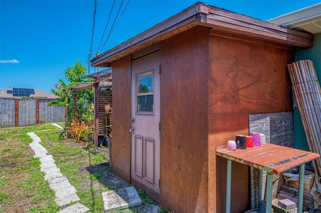 view of outbuilding with fence