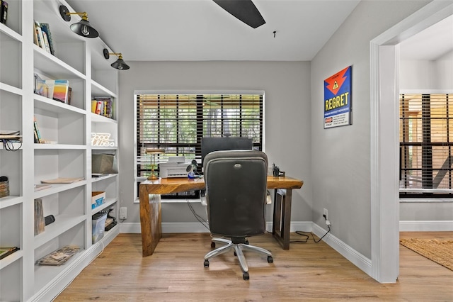 home office with baseboards, ceiling fan, and wood finished floors
