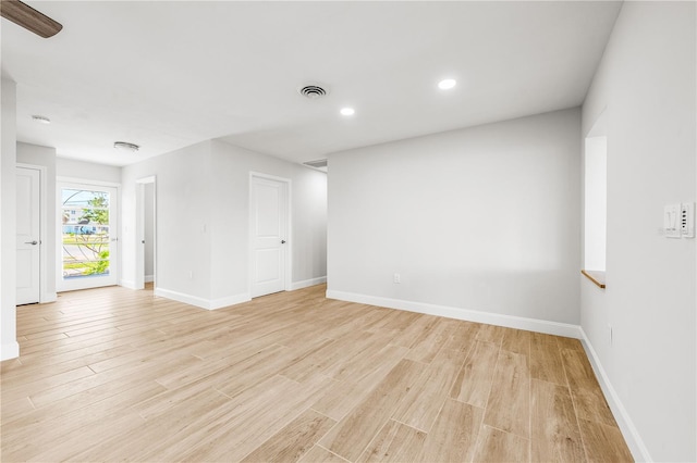 1680 Lemon Bay Dr, Venice, FL 34293 - spare room featuring light wood-style flooring, baseboards, and recessed lighting