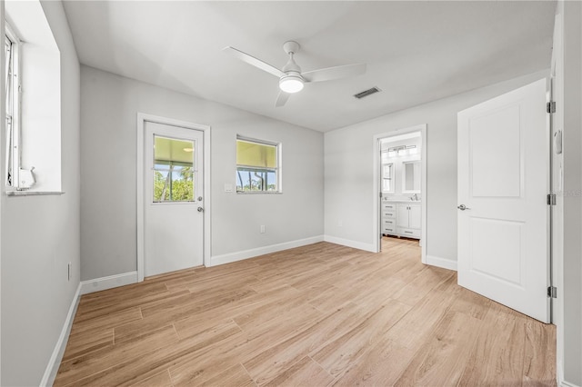 1680 Lemon Bay Dr, Venice, FL 34293 - unfurnished bedroom with light wood-type flooring, baseboards, and a ceiling fan