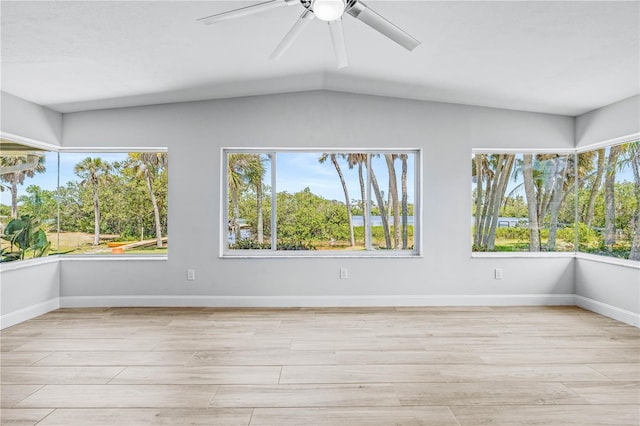 1680 Lemon Bay Dr, Venice, FL 34293 - spare room featuring light wood-style flooring, ceiling fan, lofted ceiling, and baseboards