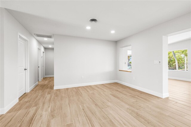 1680 Lemon Bay Dr, Venice, FL 34293 - unfurnished room featuring light wood-style flooring, baseboards, and recessed lighting