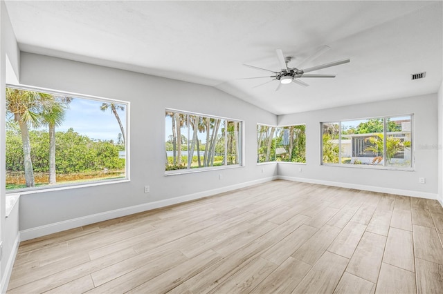 1680 Lemon Bay Dr, Venice, FL 34293 - empty room featuring a ceiling fan, light wood-style flooring, lofted ceiling, and baseboards