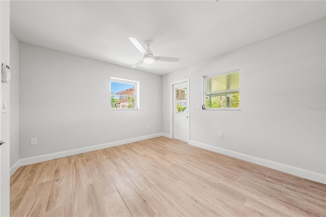 1680 Lemon Bay Dr, Venice, FL 34293 - unfurnished room with light wood-style flooring, healthy amount of natural light, and baseboards