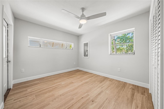 1680 Lemon Bay Dr, Venice, FL 34293 - unfurnished bedroom featuring light wood finished floors, baseboards, and ceiling fan