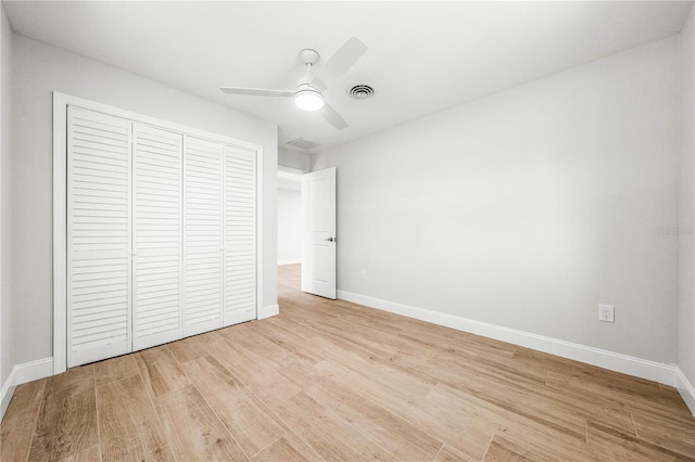 1680 Lemon Bay Dr, Venice, FL 34293 - unfurnished bedroom featuring wood finished floors, a closet, and baseboards