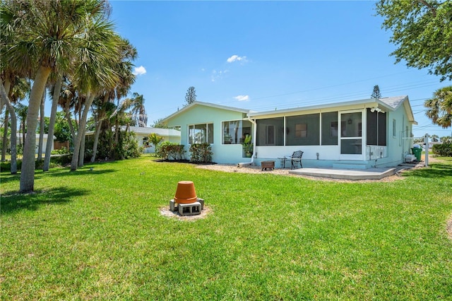 1680 Lemon Bay Dr, Venice, FL 34293 - rear view of house with a sunroom and a yard