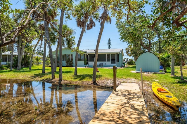 1680 Lemon Bay Dr, Venice, FL 34293 - dock featuring a lawn