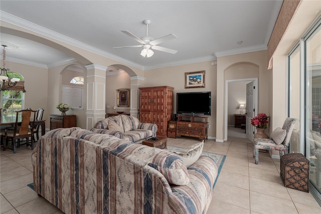 living room with arched walkways, decorative columns, light tile patterned floors, and ceiling fan with notable chandelier
