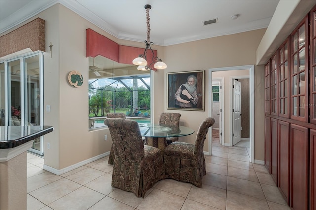 dining area featuring visible vents, ornamental molding, and light tile patterned floors