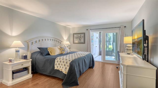 564 Lakeside Dr Unit 564, Bradenton, FL 34210 - bedroom with access to outside and light wood-style flooring