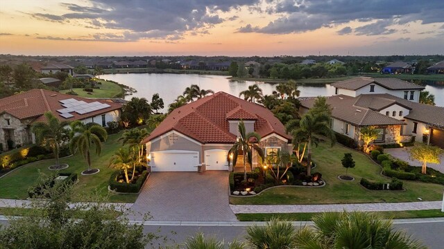 aerial view featuring a water view and a residential view